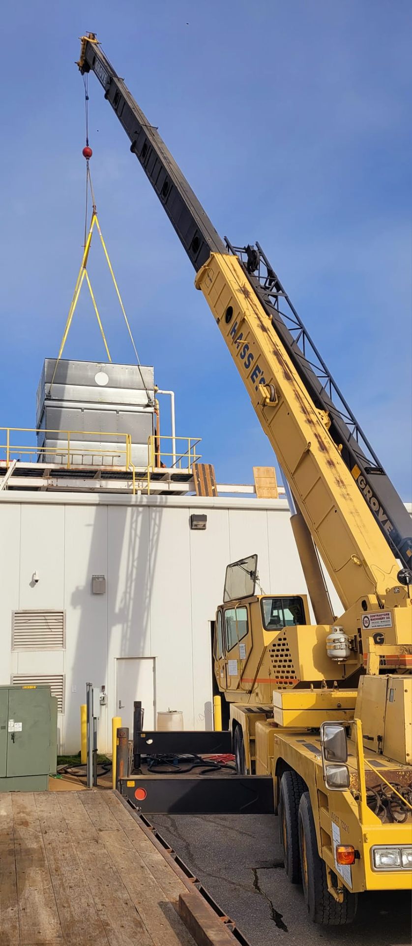 Hasse's crane lifting HVAC equipment