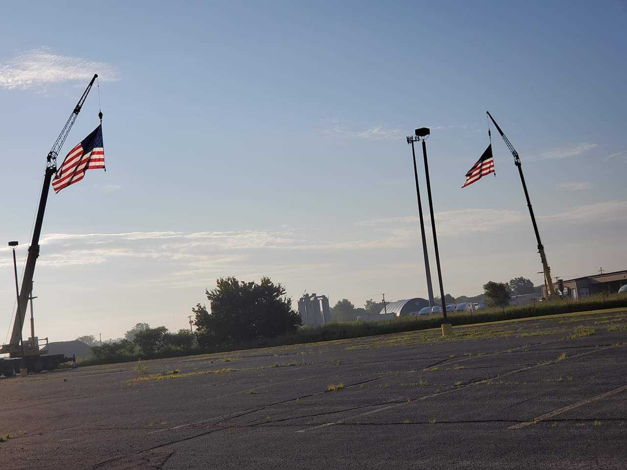 Hasse's cranes flying American flags